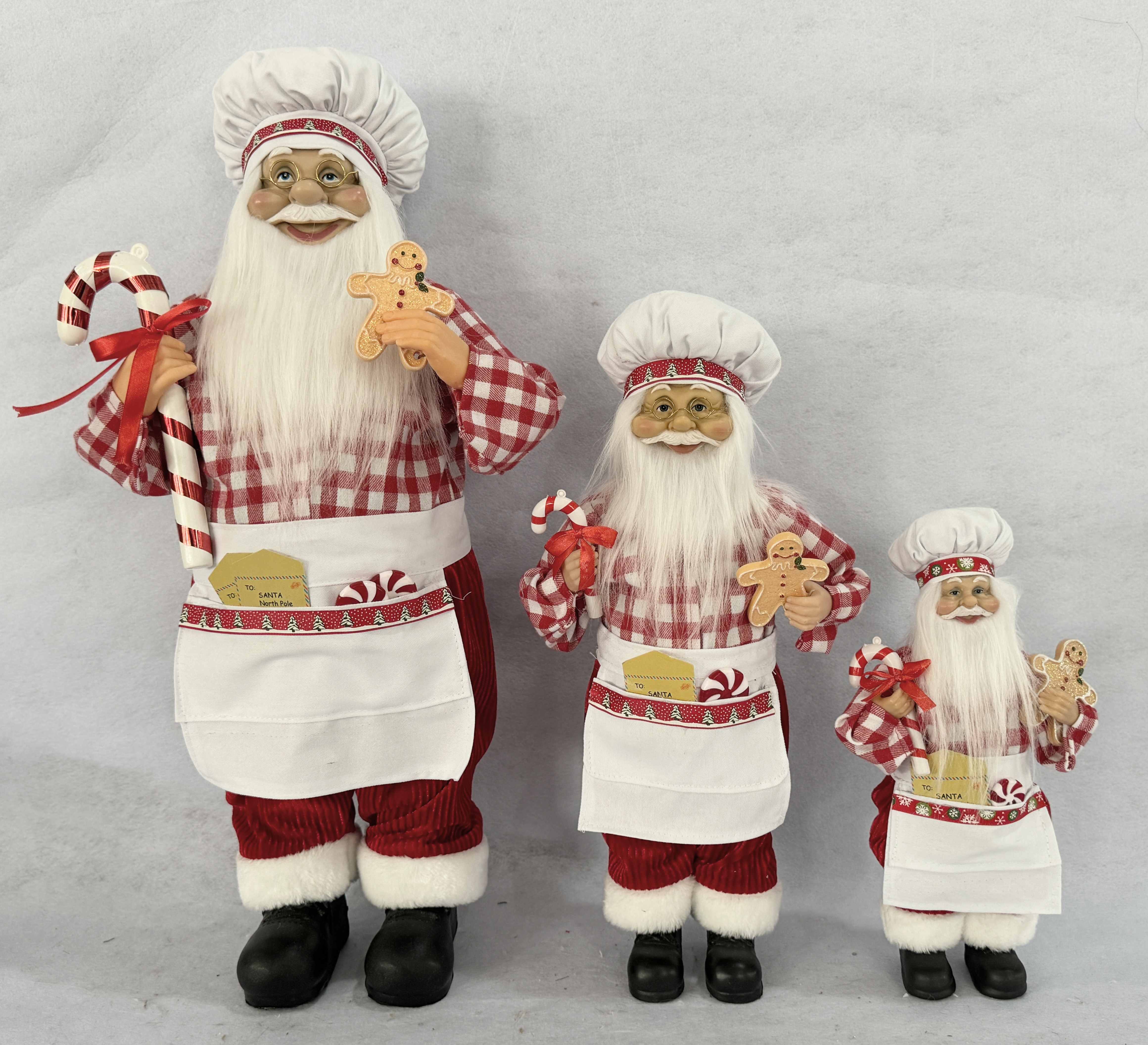 Santa chef with ginger bread and candy cane